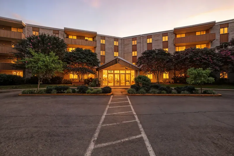 Condo building entrance at twilight in Bethesda, MD