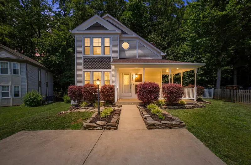 Farmhouse-style home at twilight in Montclair, VA