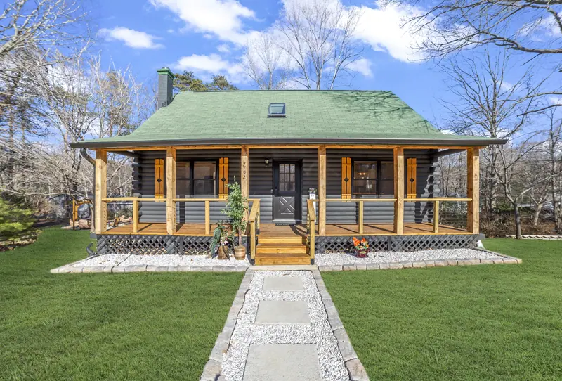 Log cabin exterior with front porch in Lusby, MD