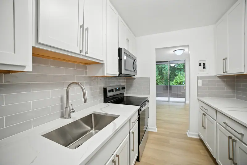 Renovated condo kitchen with quartz counters in Bethesda, MD