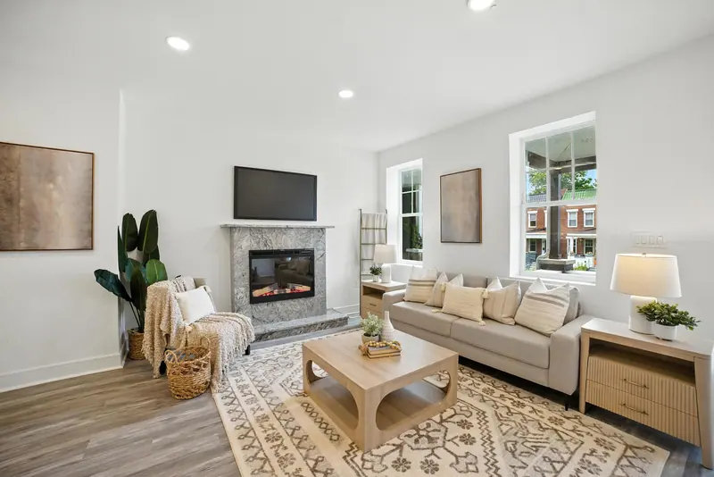 Renovated rowhome living room with fireplace in Baltimore, MD