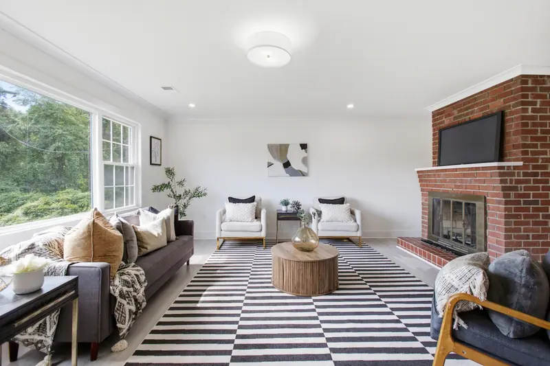 Living room with brick fireplace in Lanham, MD