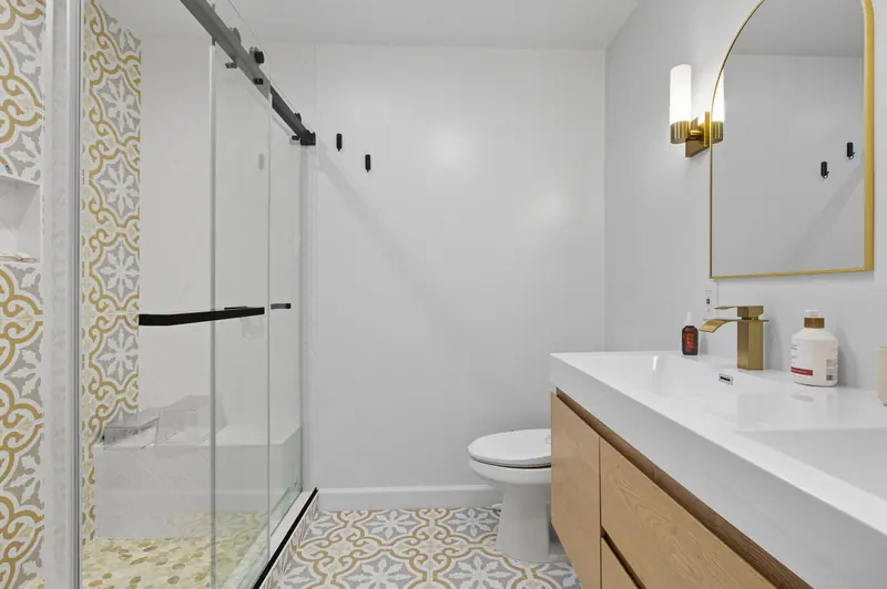Renovated bathroom with patterned tile in Silver Spring, MD
